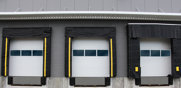 sectional door for dock leveler